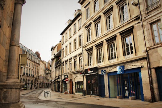 Picturesque empty street in Besançon, France showcasing historic architecture.