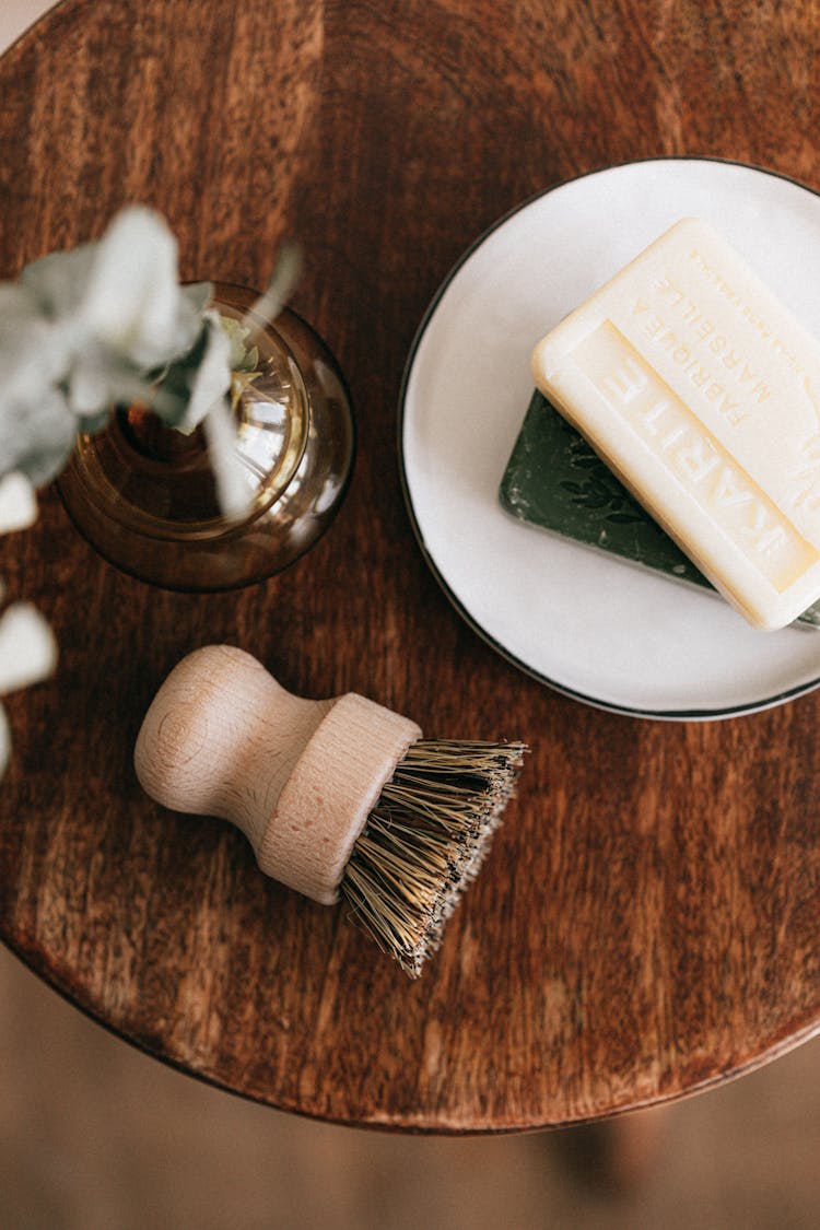 Natural Soaps And Shaving Brush With Vase On Table