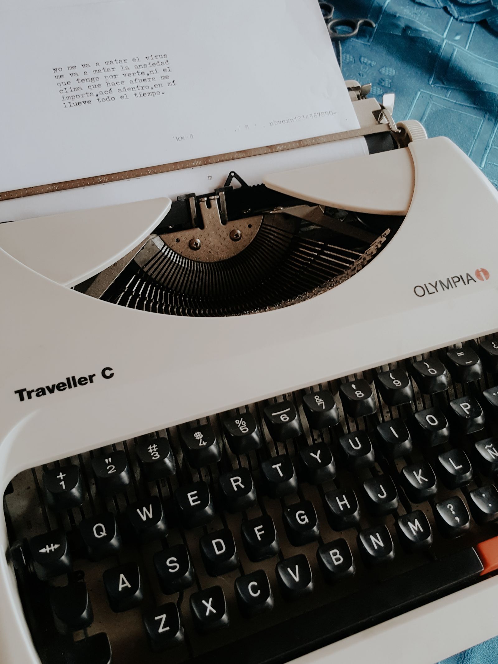 Close-up of a vintage typewriter with a sheet of paper mid-page