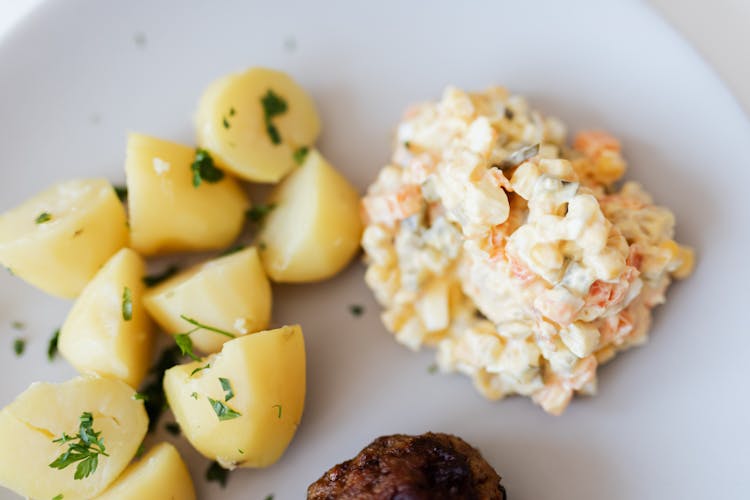 Boiled Potatoes Near Traditional Russian Salad