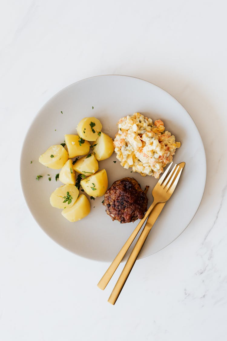 Boiled Potatoes With Salad And Meat Rissole