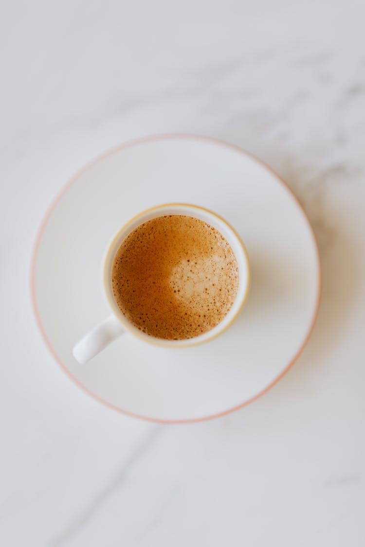 Cup Of Coffee On White Saucer