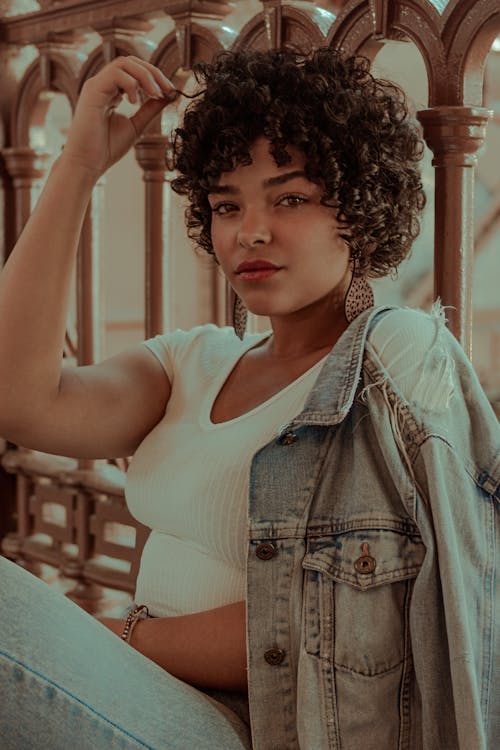 Woman Wearing White Top and Denim Jacket