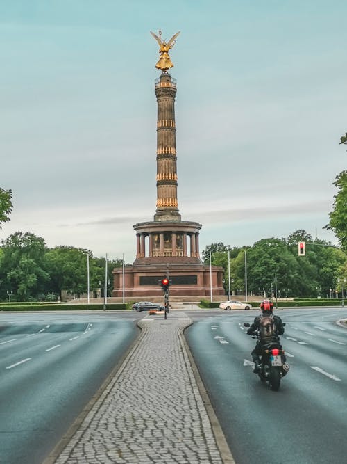 Person Riding Motorcycle on Road