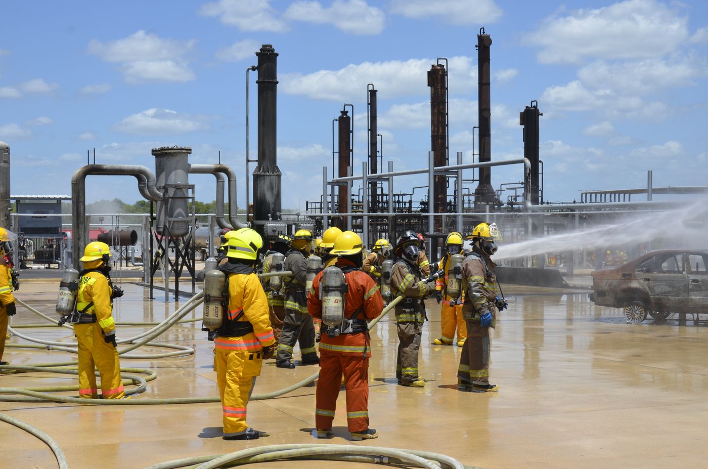 Firefighters conducting an industrial safety drill