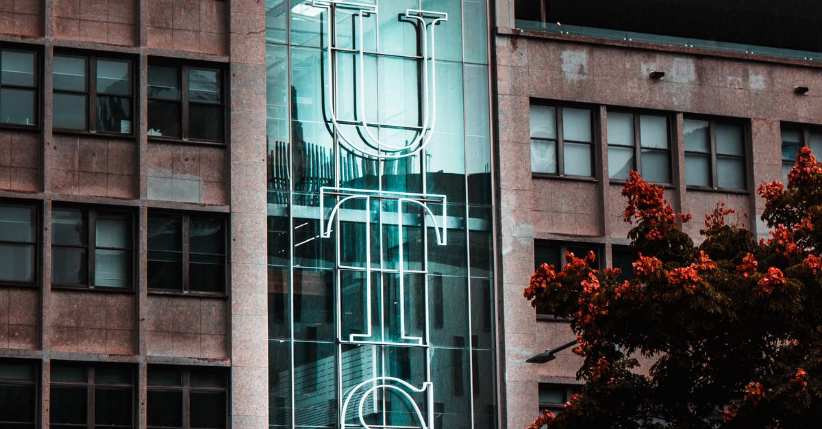 Illuminated Signage on a Brown building · Free Stock Photo
