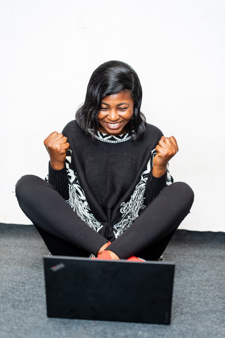 Excited Black Woman Showing Yes Gesture Near Laptop