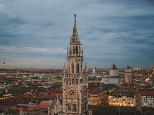 Free A stunning view of Munich's New Town Hall at dusk showcasing its Gothic architecture. Stock Photo