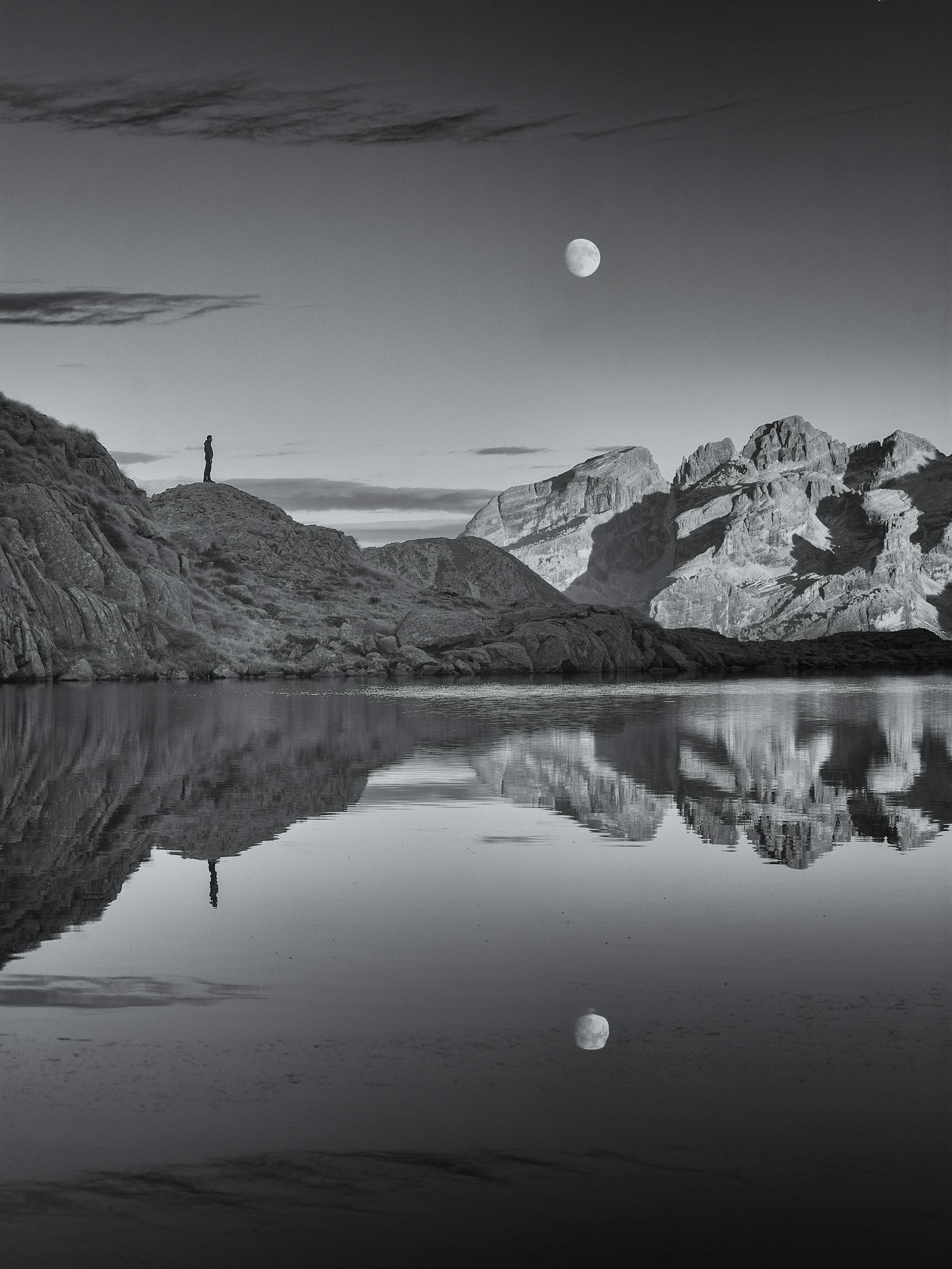 Grayscale Photo of Lake and Mountains