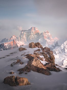 Snow Covered Mountain with the Quote "You're on earth. There's no cure for that." written on it and have average color value #8D878D