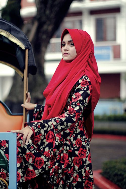 Free Woman in Red Hijab and Floral Dress Stock Photo