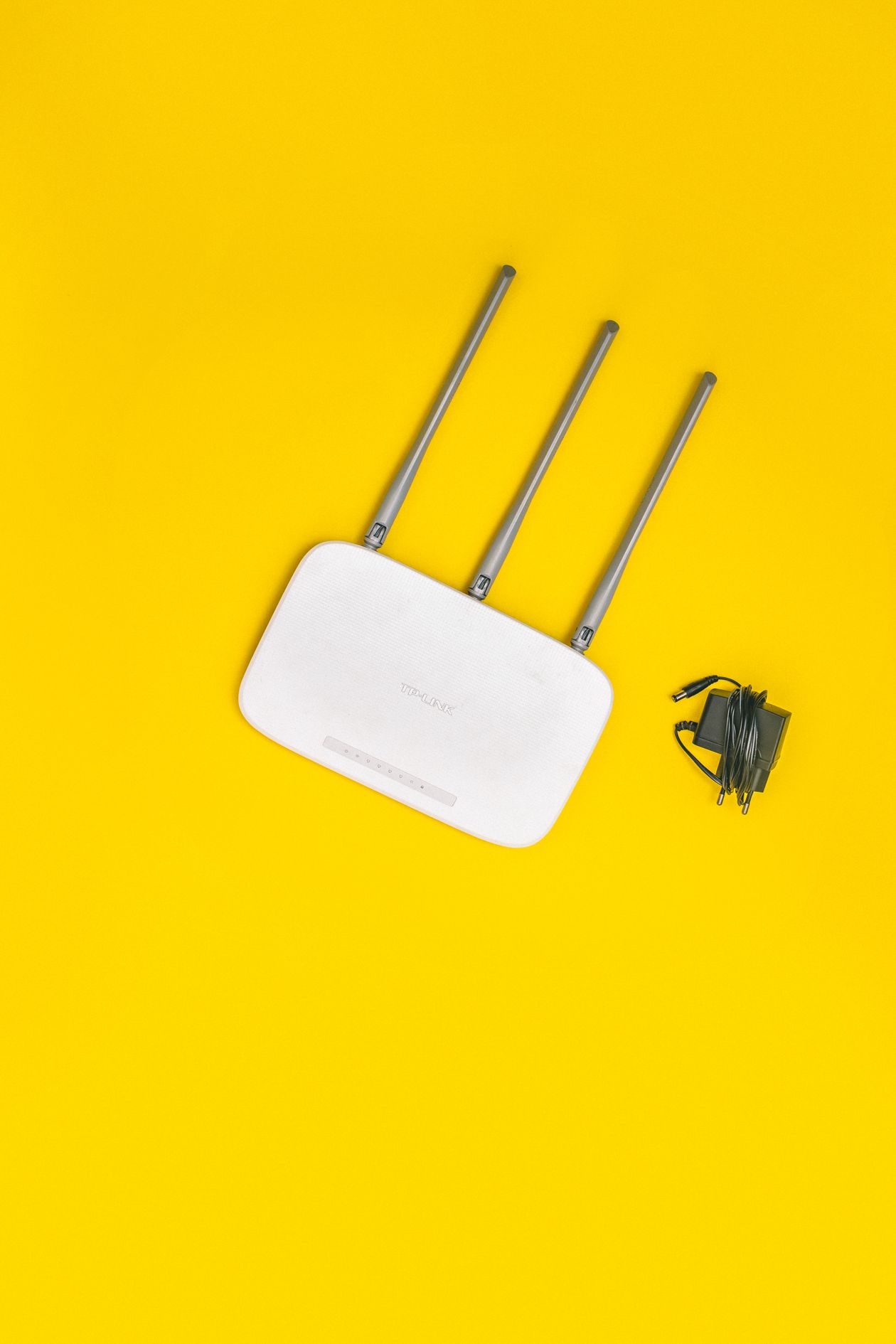 White router with antennas on a bold yellow background representing referral software integrations