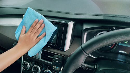 Free Crop person wiping modern car panel Stock Photo
