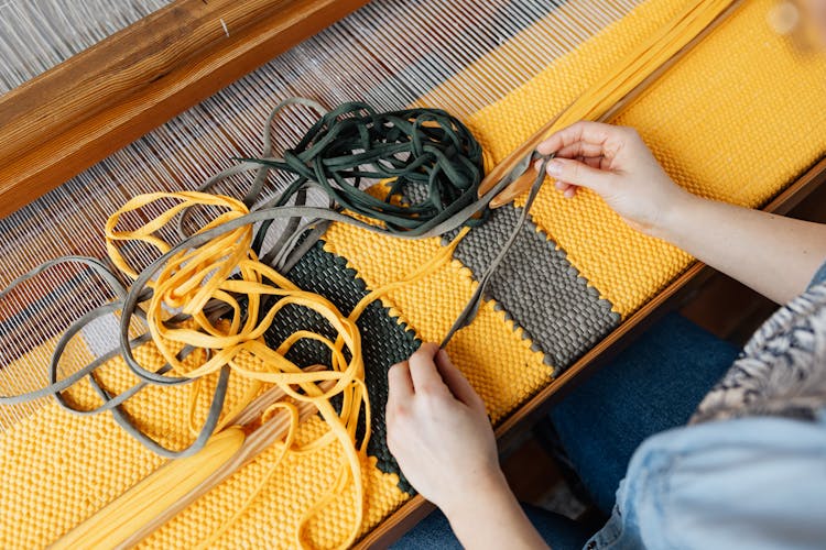 Crop Unrecognizable Craftswoman Working On Weaving Loom Machine