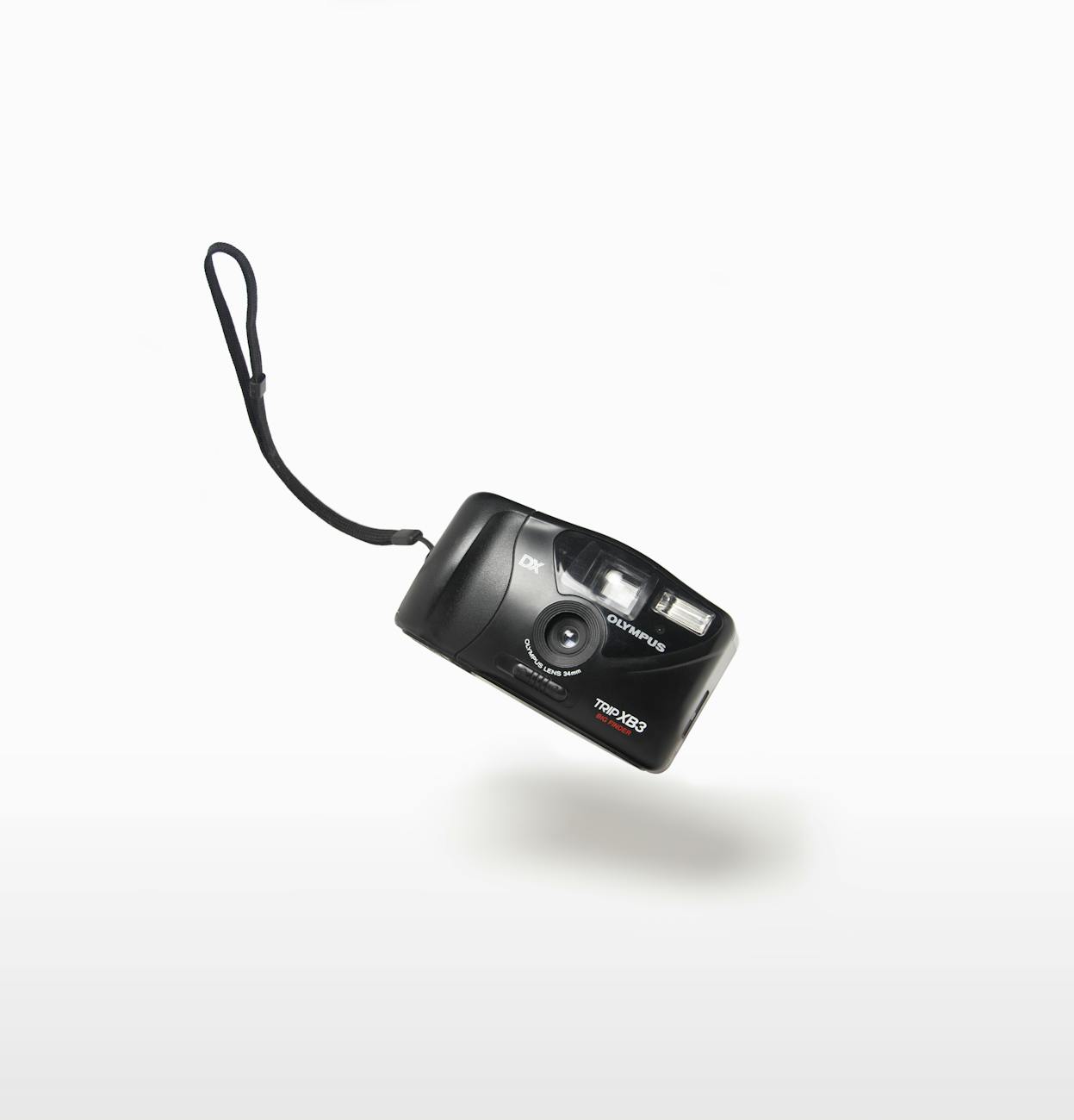Classic vintage film camera floating on a white background, creating a nostalgic feel.