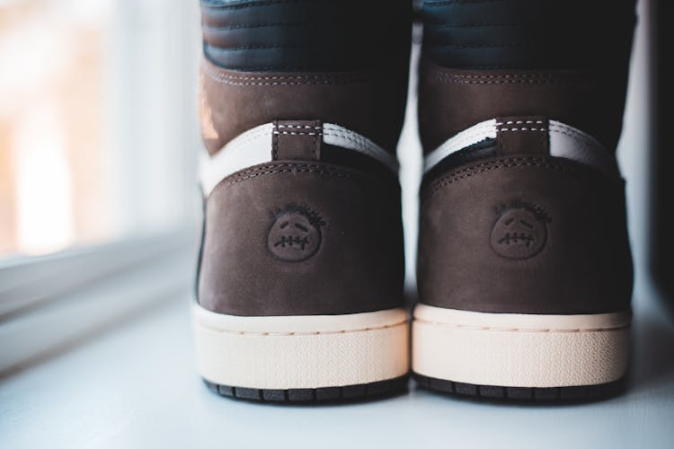 Trendy Suede Sneakers Placed On White Windowsill