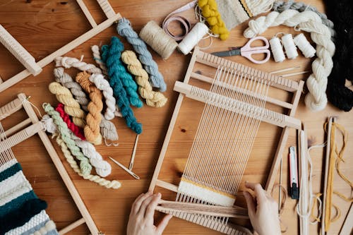 Free Top View Photo of Person Using Hand Loom Stock Photo