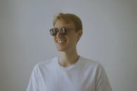 Man in White Crew Neck Shirt Wearing Black Framed Eyeglasses