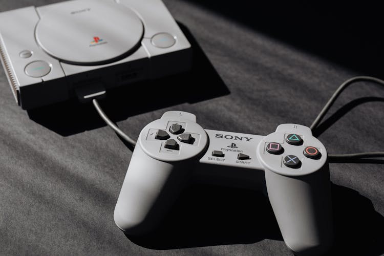 Photo Of Play Station Game Console And Remote Controller