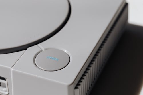 Close-Up Photo of Gray Video Game Console
