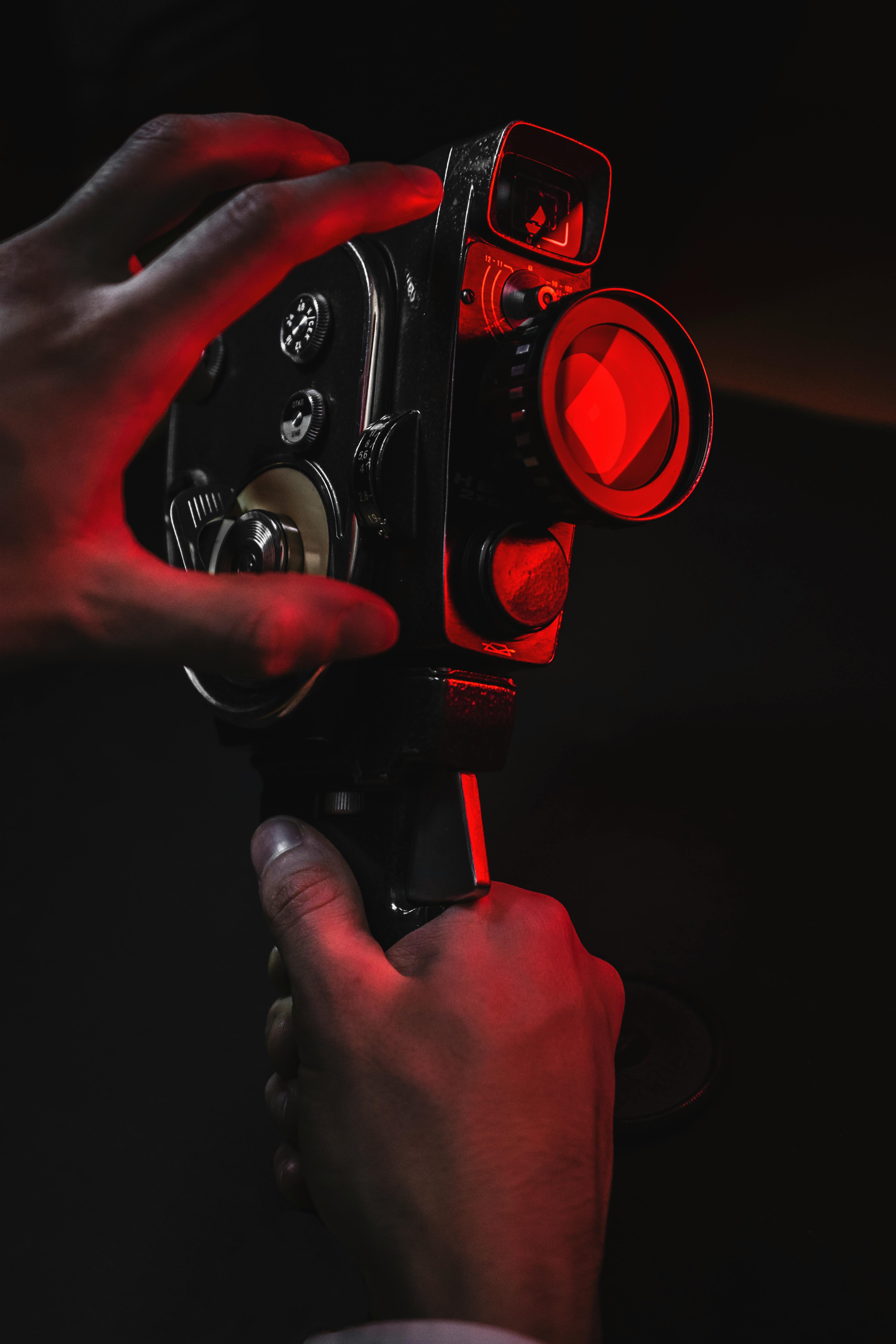 person holding black camera