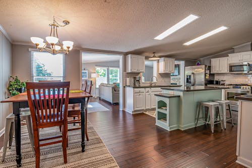 Brown Wooden Dining Table Near the Kitchen