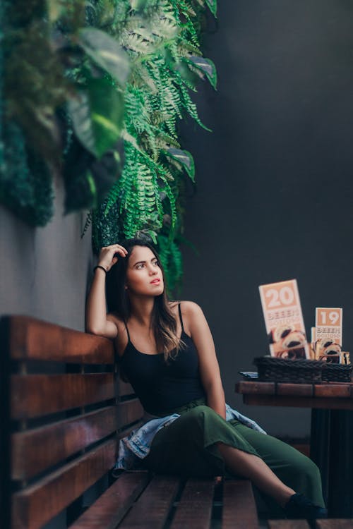 Portrait of Beautiful Woman Sitting on Bench 