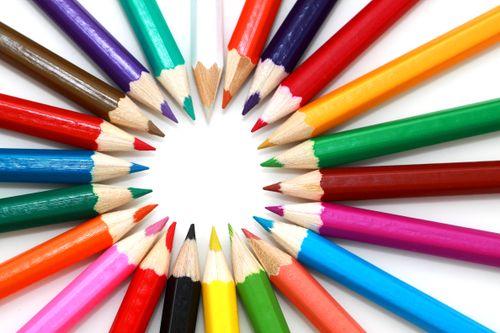 Free A vivid and artistic arrangement of sharpened colored pencils in a circular pattern. Stock Photo