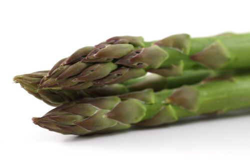 Free Macro shot of fresh green asparagus spears, showcasing their vibrant texture and healthy appeal. Stock Photo
