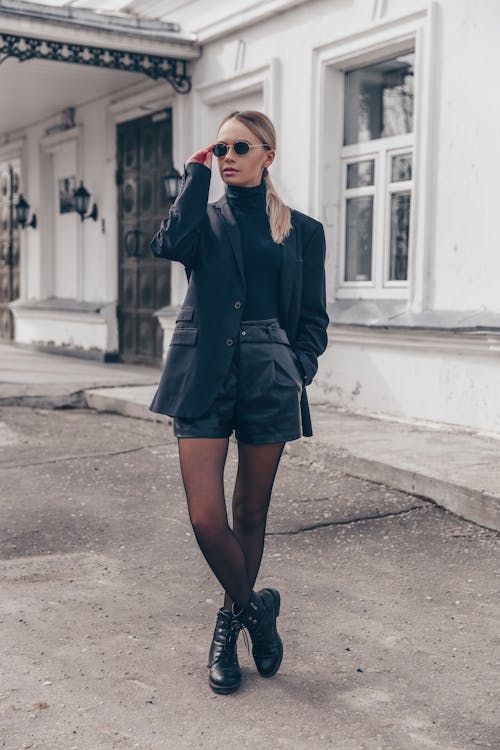 Woman in Black Coat Standing on Road
