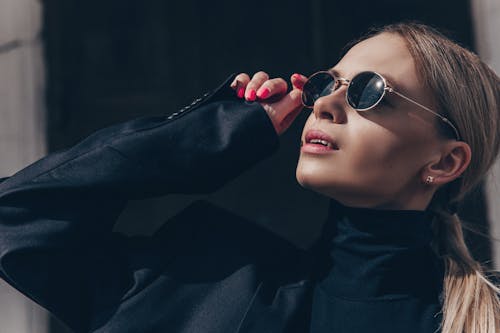 Close Up Photo of Woman Wearing Sunglasses