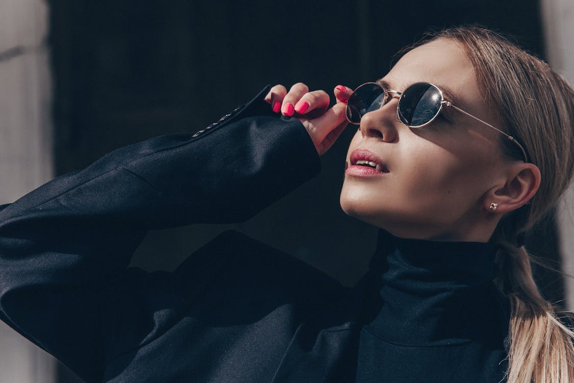 Close Up Photo of Woman Wearing Sunglasses