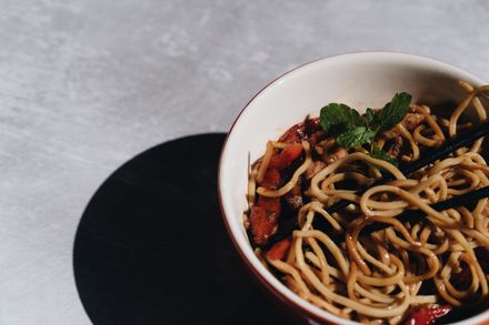 Noodle bowl with herbs — photo by alleksana on Pexels