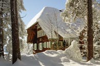 Brown and White Wooden House Covered With Snow
