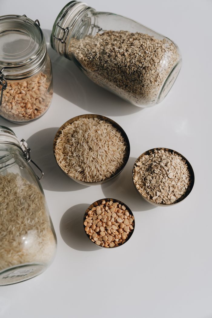 Millet grains and flour in bowls