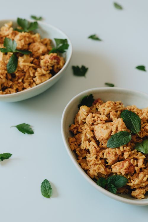 Free Delicious savory oats with fresh herbs served in bowls, perfect for a healthy breakfast. Stock Photo