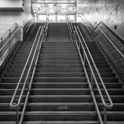 Free Black and white stairs of stairway going upstairs to entrance of spacious building Stock Photo