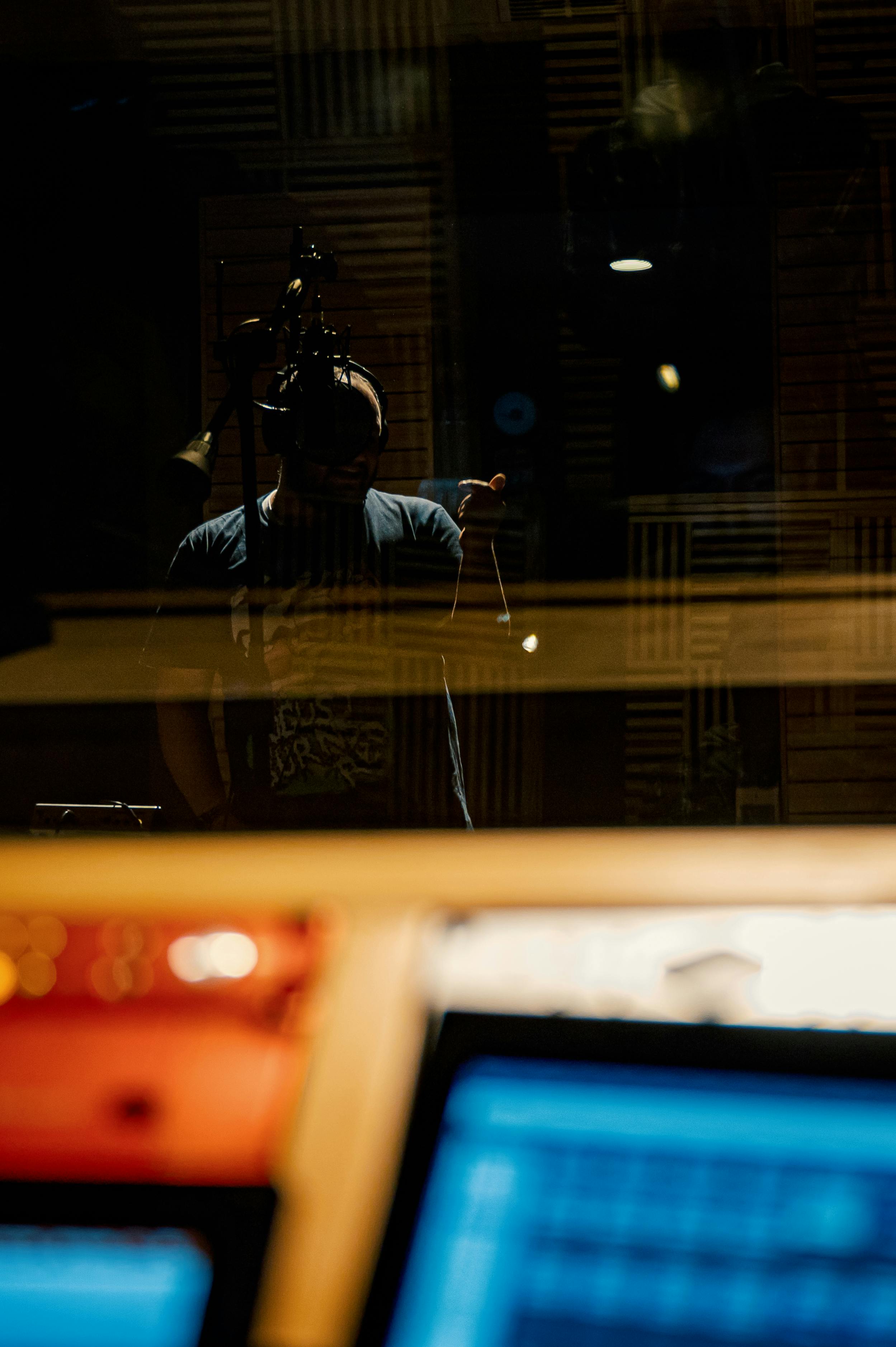 man singing song in music studio