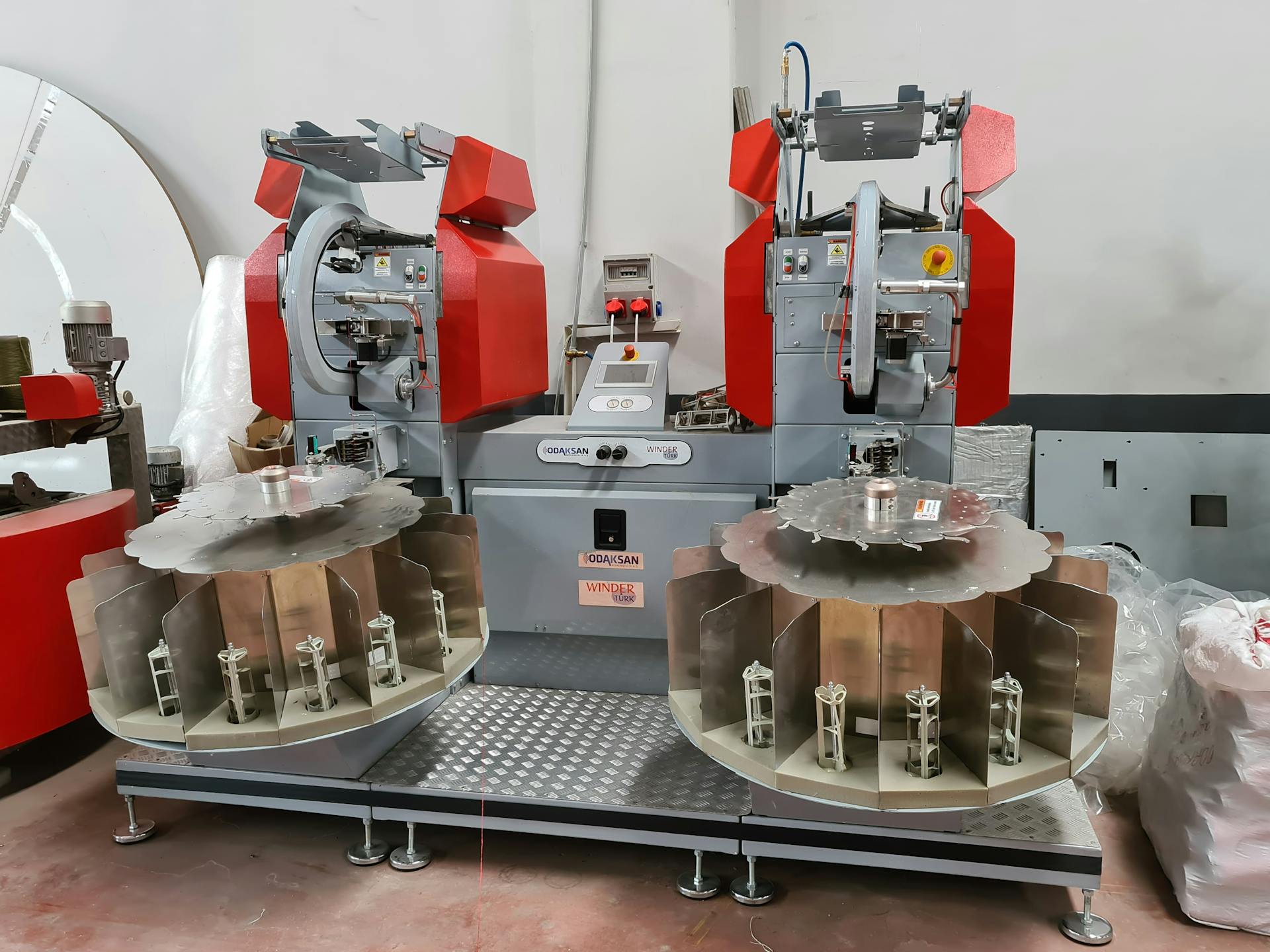 Large industrial yarn winding machine in a textile factory setting in Gaziantep, Turkey.