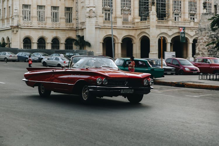 Red Convertible Car On The Road