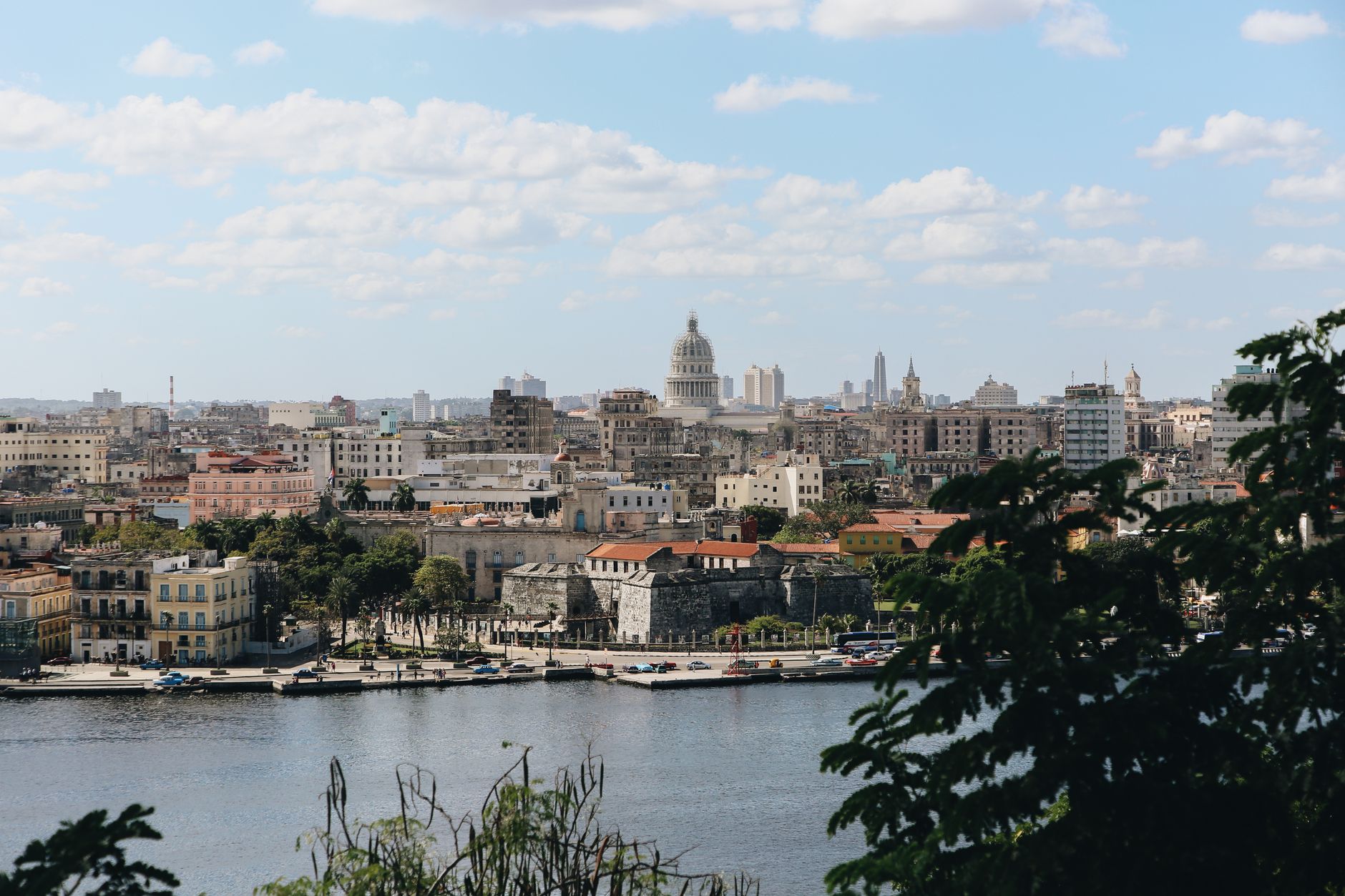 Beautiful cityscape view of Havana, Cuba with its iconic architecture and waterfront under a clear sky.