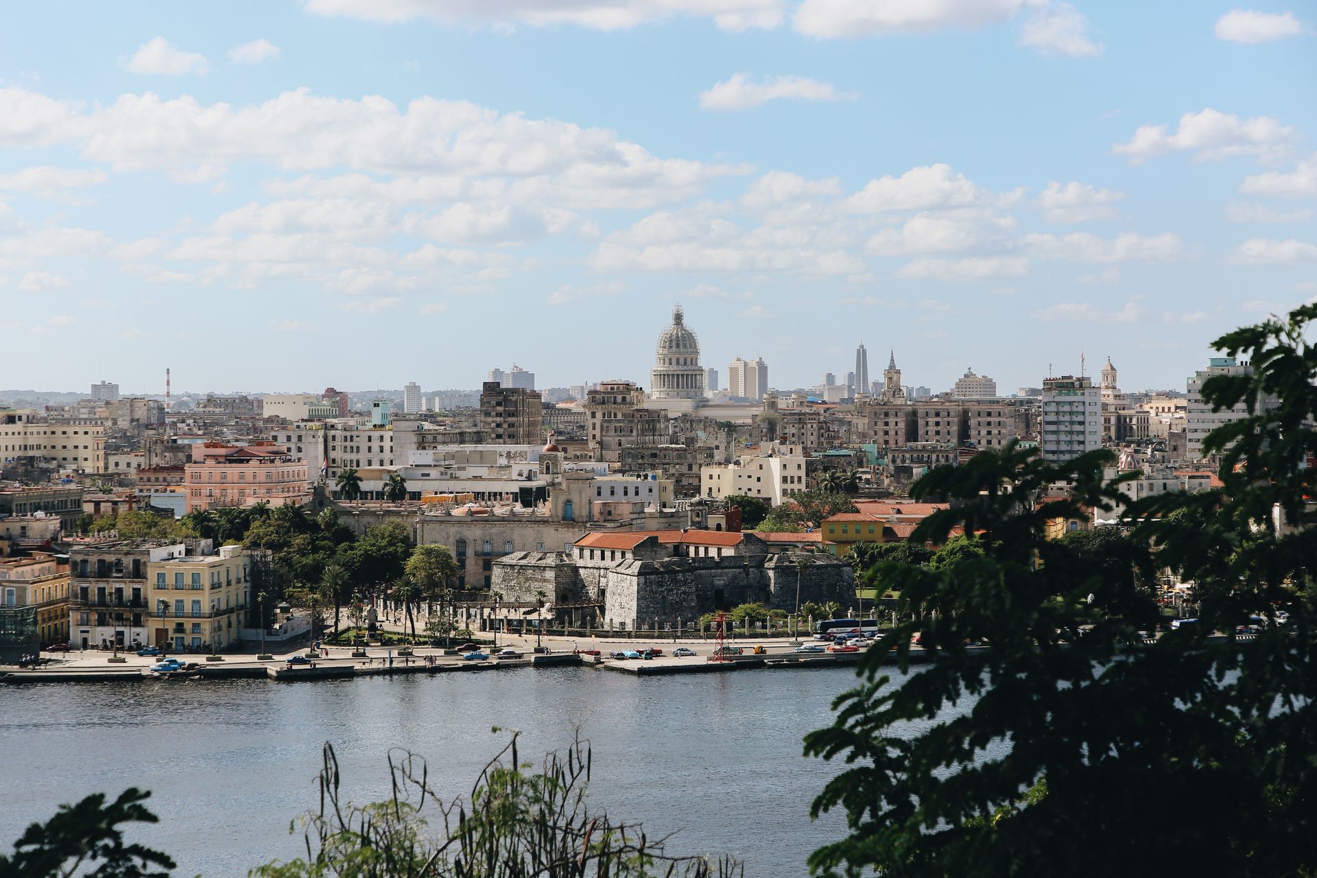 Beautiful cityscape view of Havana, Cuba with its iconic architecture and waterfront under a clear sky.