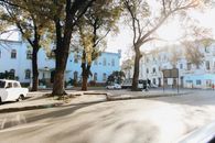 Captivating view of Havana streets in the early light, showcasing colonial architecture and classic cars.