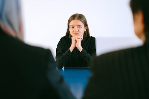 Woman in Black Blazer Sitting Being Interview