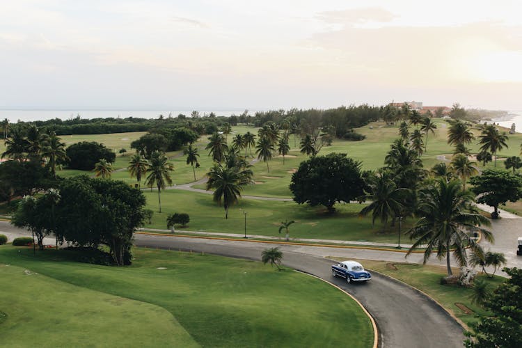 Vintage Car Passing Golf Course