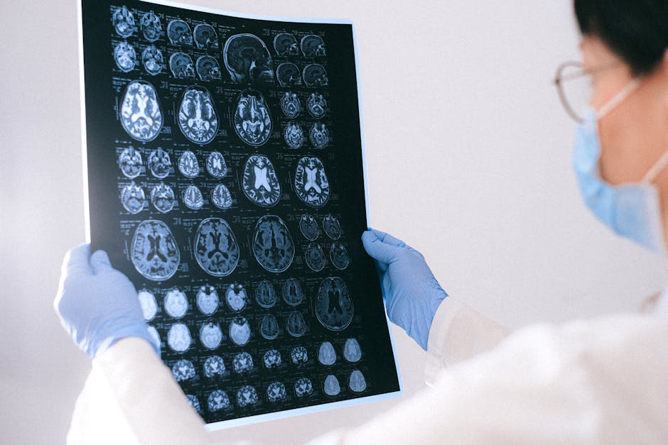 A researcher looking at brain scans - tms for bipolar