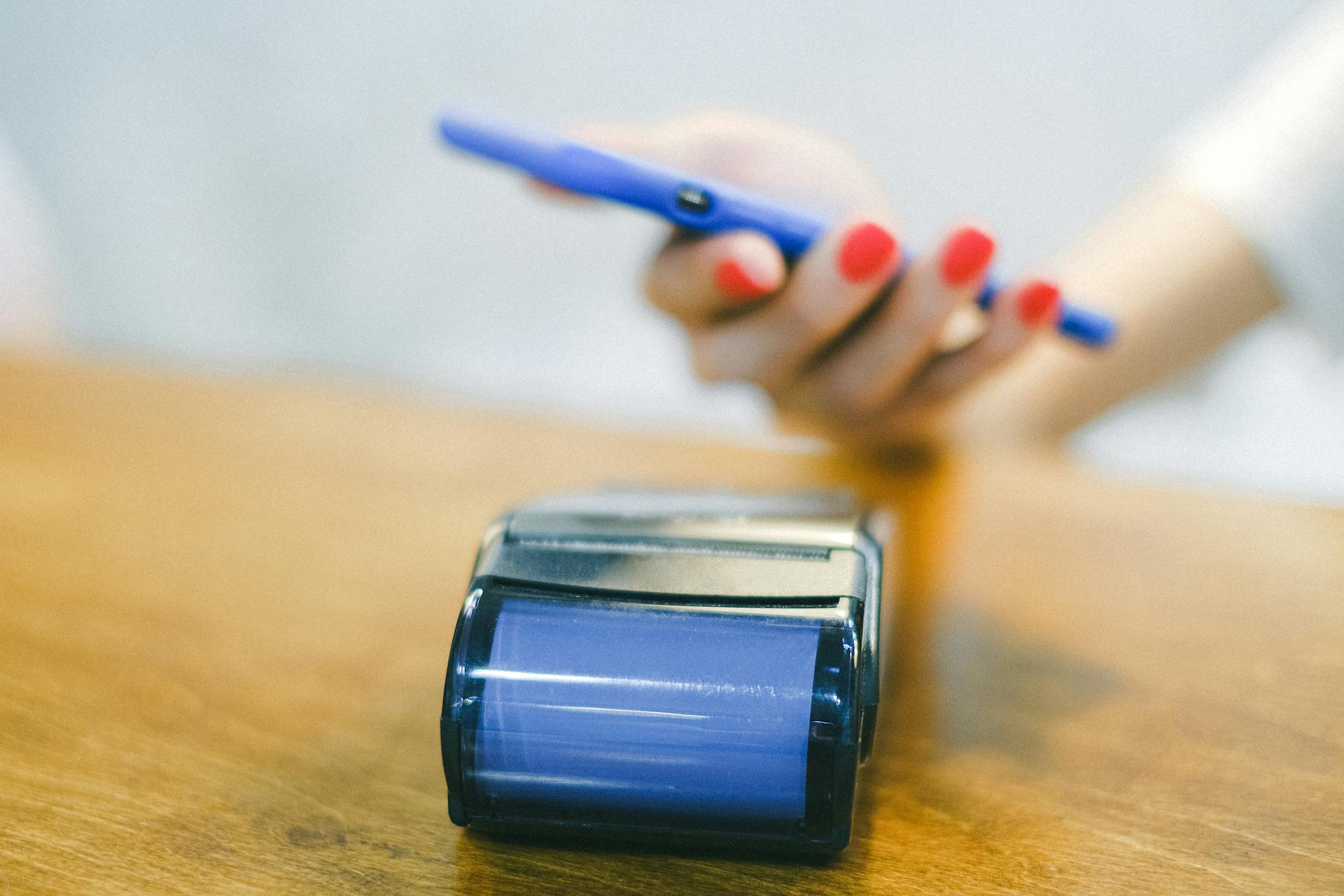 A Person Paying Using a Smartphone