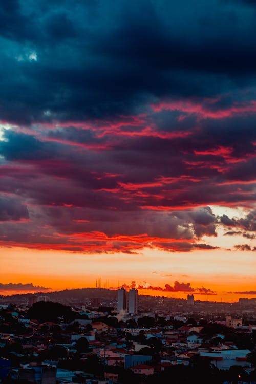 Dramatic sundown over mountains by settlement