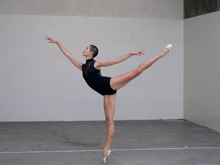 Focused Ballerina Training In Studio