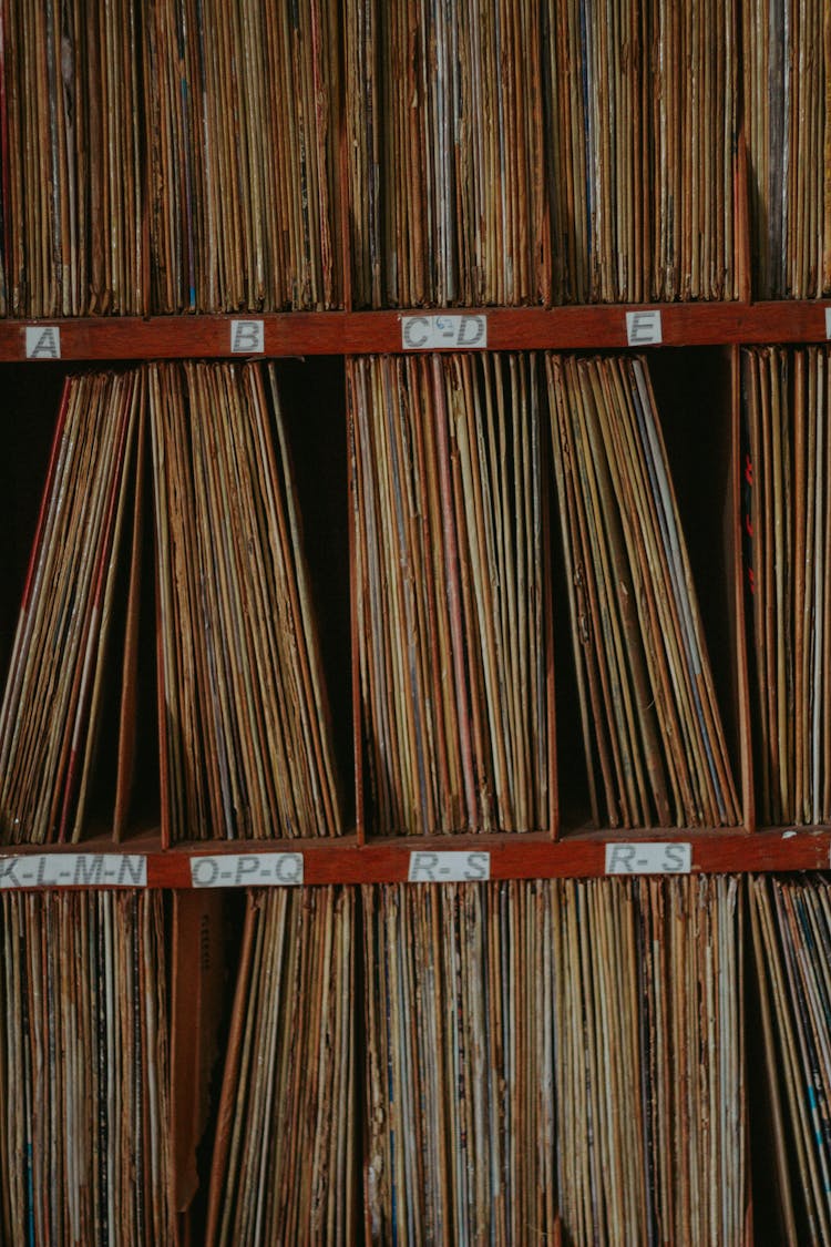 Stack Of Paper Documents On Shelves